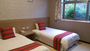 Postel nebo postele na pokoji v ubytování Liwu Hotel Taroko