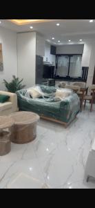 a living room with a large bed in the middle at Kelibia in Kelibia
