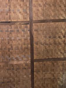 a close up of a wood paneled wall at Least desirable room in Rwamagana
