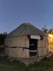 a large dome tent sitting in the grass at Nomads Home in Tong