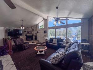 a living room with a couch and a table at Bear Lake Ranch with Bear Lake Access in Garden City
