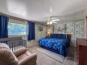 a bedroom with a bed and a ceiling fan at Bear Lake Ranch with Bear Lake Access in Garden City
