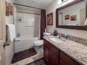 a bathroom with a tub and a toilet and a sink at Bear Lake Ranch with Bear Lake Access in Garden City +39 photos