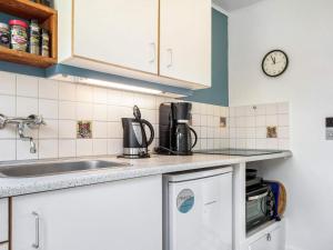 a kitchen with a sink and a counter top at 4 person holiday home in Allinge in Allinge +19 photos