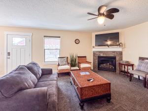 a living room with a couch and a fireplace at Bear Lake Bungalow in Garden City
