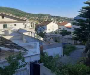 a view of a city with houses and a street at Belle vue in Aïn Draham