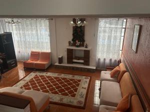 a living room with a couch and a table at Alojamiento Rosales in San Antonio