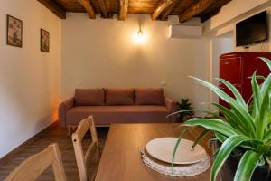 a living room with a couch and a table at Casa Runcis in Cavasso Nuovo