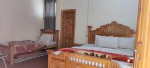 a bedroom with two beds in a room at Turgil Green Resort in Nomal