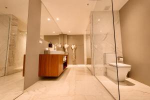 a bathroom with a toilet and a sink and a shower at Hotel San Felipe in Panama City +30 photos