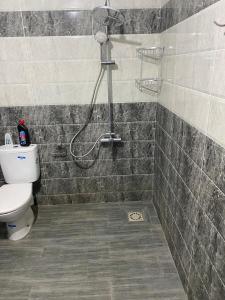 a bathroom with a shower and a toilet at Appartement 3 in Al Hoceïma