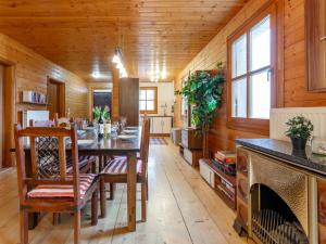 a dining room with a table and chairs at Karawankenpanorama L in Liebenfels