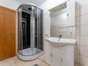 a bathroom with a shower and a sink at Karawankenpanorama L in Liebenfels +19 photos