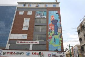 a building with a mural on the side of it at Hotel O Royal Stay in Bangalore