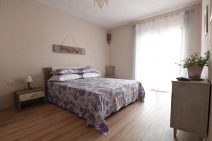 Postel nebo postele na pokoji v ubytování Apartment Stella