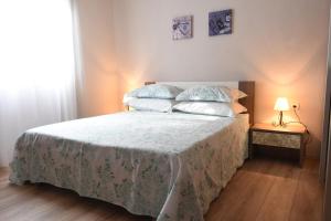 Postel nebo postele na pokoji v ubytování Apartment Stella