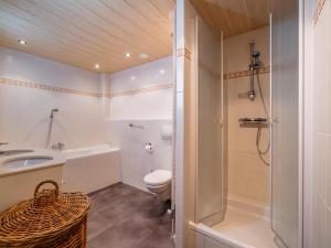 a bathroom with a toilet and a sink and a shower at De Brouwersdam in Ouddorp +39 photos