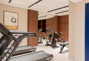 a gym with a bunch of exercise bikes at Hotel Leev Miromesnil & Spa in Paris