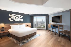 a bedroom with a bed and a desk and a television at Le Méridien Mexico City Reforma in Mexico City +103 photos