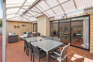 a dining room with a table and chairs at Clearwater - Cosy Comforts Steps from the Beach in Dunsborough