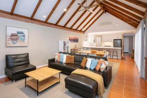 a living room with a couch and a table at Clearwater - Cosy Comforts Steps from the Beach in Dunsborough