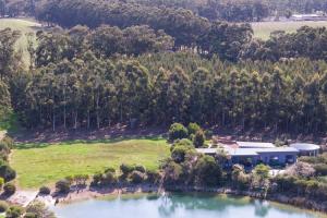 an aerial view of a house next to a lake at Bonnie - Lakeside Relaxation surrounded by Wineries in Wilyabrup