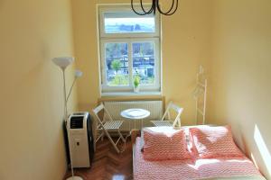 Postel nebo postele na pokoji v ubytování Lidi Guesthouse