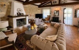 a living room with a couch and a fireplace at Villa Novel in Višnjan