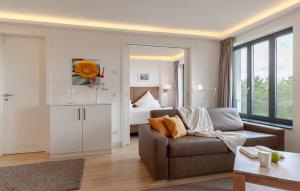 a living room with a couch and a bed at Princess in Binz