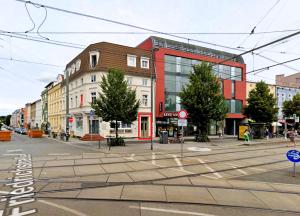 an empty street in a city with buildings at Apartment in zentraler Lage No 3 in Rostock