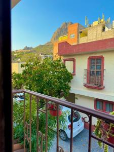 a view from a balcony of a building with a car at Hotel Casa de Los Abuelos in Bernal
