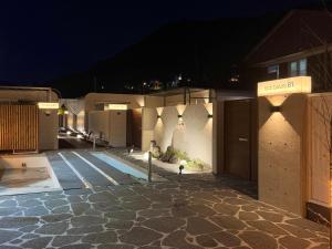 a group of buildings at night with lights at 담양 다움 스파 빌리지 in Haktong-ni