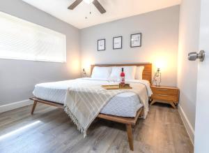 a bedroom with a bed with a nightstand and a window at Stylish Dania Beach Stay Beach, Cruise Port FLL Airport in Dania Beach +21 photos
