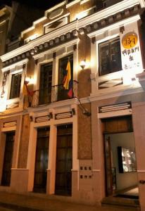 a building with a flag in front of it at HOTEL en el CENTRO HISTORICO in Cuenca