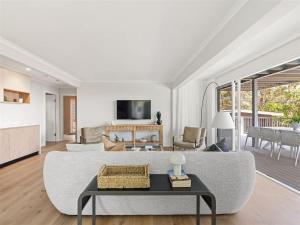 a living room with a couch and a table at Eagle Heights - Elevated Oasis with Pool & Sea Views in Dunsborough +39 photos