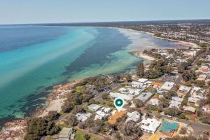an aerial view of a beach with houses and the ocean at Torretta by the Bay in Dunsborough