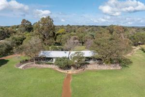 an aerial view of a house in a field with trees at Petra Olive 1 in Yallingup