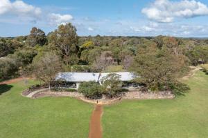 an aerial view of a house in a field with trees at Petra Olive 2 in Yallingup