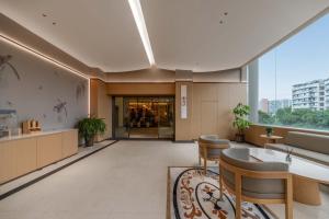 an office lobby with a view of a building at GH Hotel in Chengdu