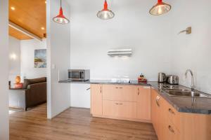 a kitchen with a sink and a counter top at Petra Olive 4 in Yallingup +10 photos