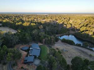 an aerial view of a house with a lake at Lake View - Contemporary Comforts meets Nature in Quindalup