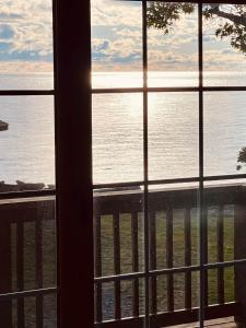 a view of the ocean from a window at The SeveraLena, your Tawas Point destination! in East Tawas