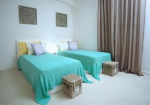 Tempat tidur dalam kamar di Lidia Villa