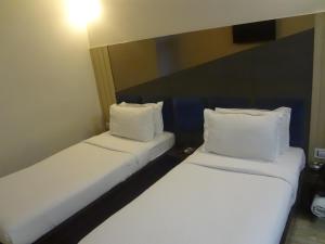 Postel nebo postele na pokoji v ubytování Hotel Sapna