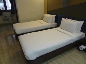 Postel nebo postele na pokoji v ubytování Hotel Sapna