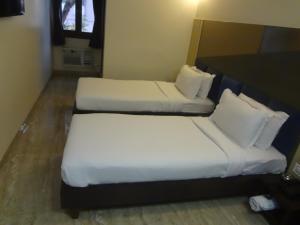 Postel nebo postele na pokoji v ubytování Hotel Sapna