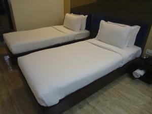 Postel nebo postele na pokoji v ubytování Hotel Sapna