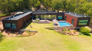 an aerial view of a house with a swimming pool at Sophie's Vineyard - Sprawling Scenery with Pool in Yallingup