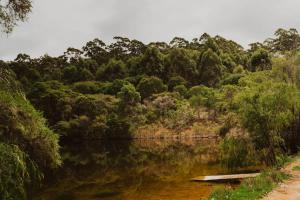 a body of water with trees in the background at Wandagar Eco Tent - Baudin in Pemberton