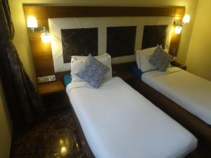 Postel nebo postele na pokoji v ubytování Hotel Sapna